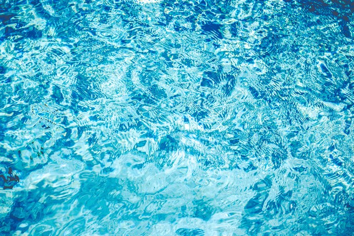 Turquoise water surface with ripples