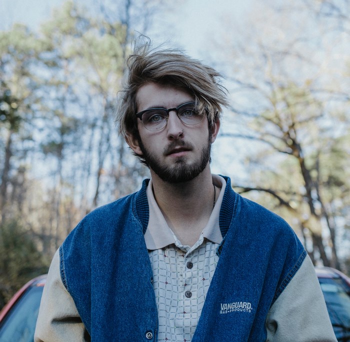 Man wearing glasses and Vanguard jacket