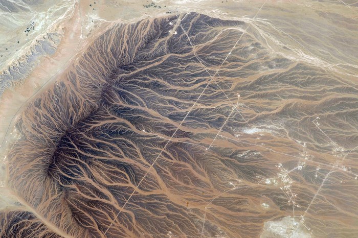 Aerial view of desert landscape with dendritic drainage patterns