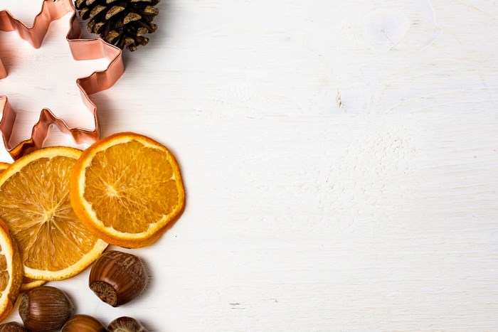 Festive Holiday Arrangement with Orange Slices and Pinecone