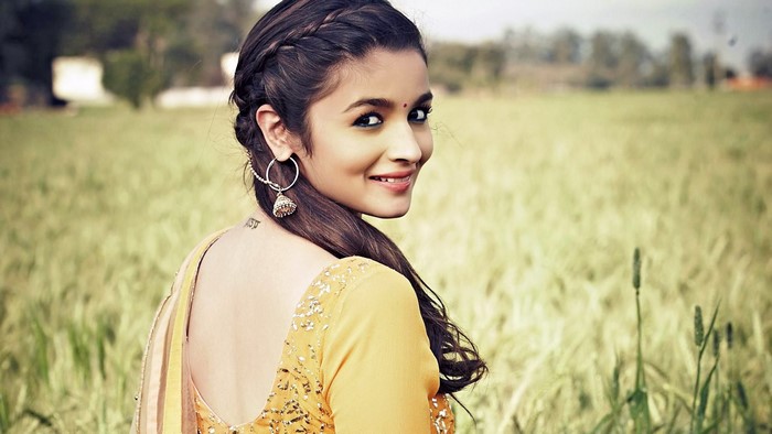 Alia Bhatt in a yellow outfit in a field