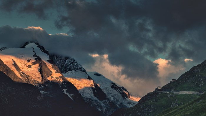 Sunset Over Snow-Capped Mountain Valley