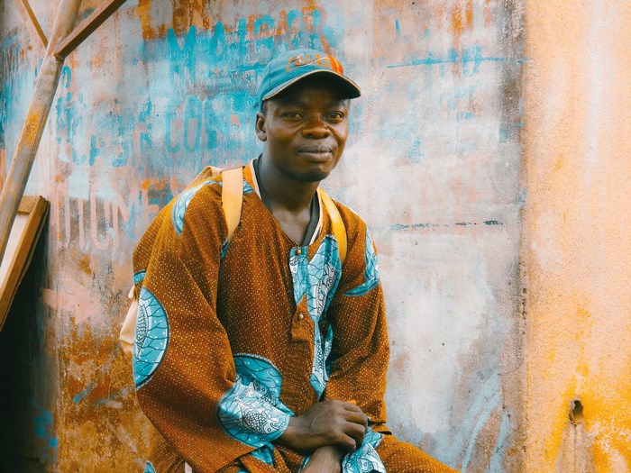 Man in colorful African clothing and cap