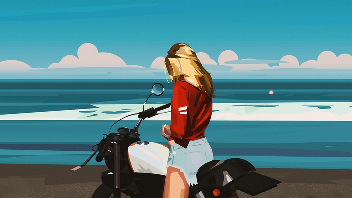 Woman on a motorcycle by the ocean