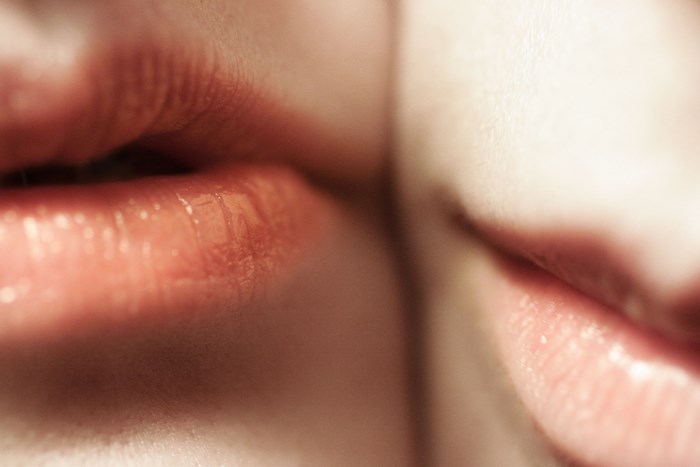 Close-up of two people's lips