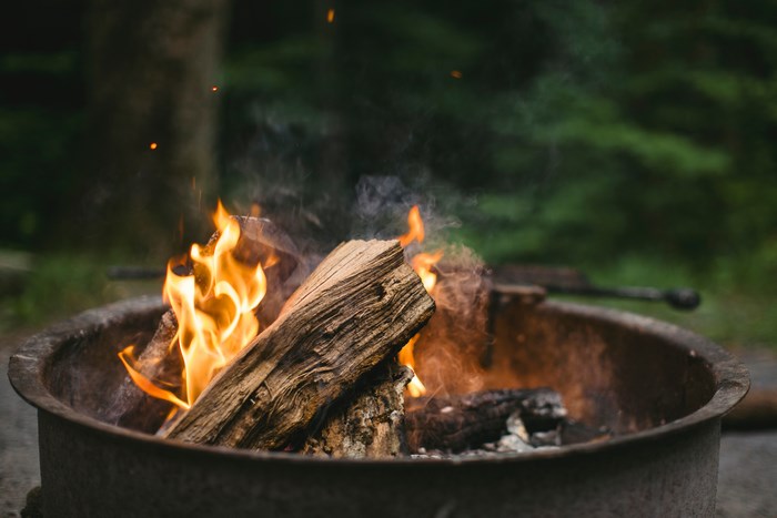 Campfire burning in a fire pit outdoors