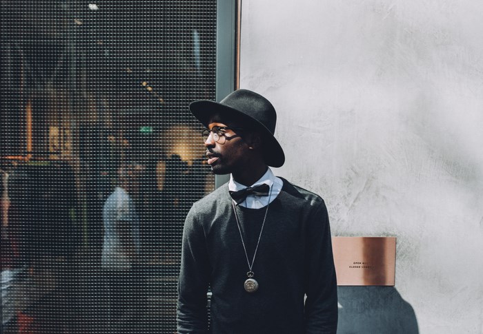 Man in hat and bow tie with pocket watch