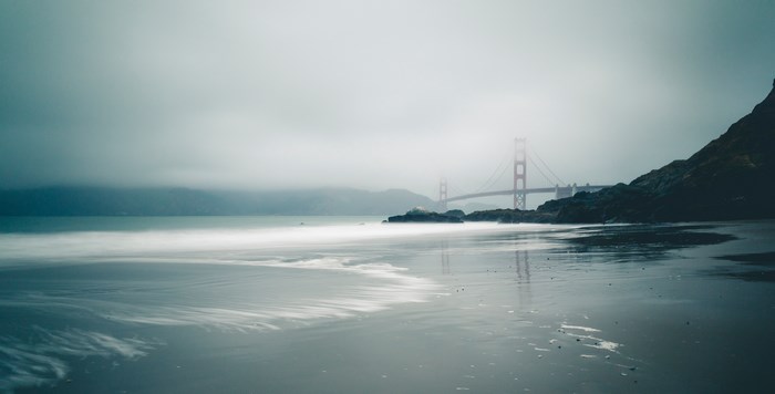 Golden Gate Bridge in Fog Over Ocean