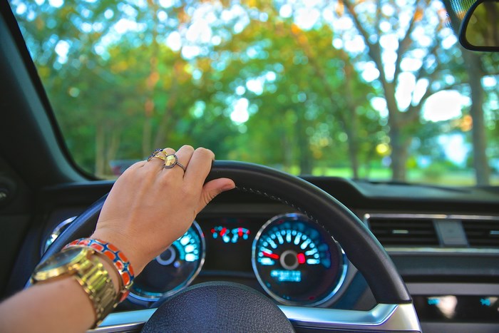 Woman driving a car on a sunny day