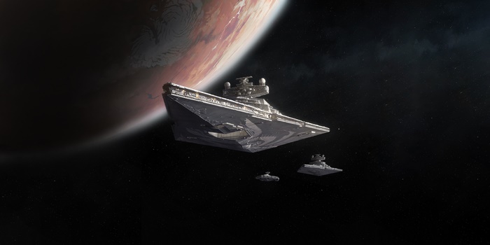 Star Destroyer fleet in space near a planet