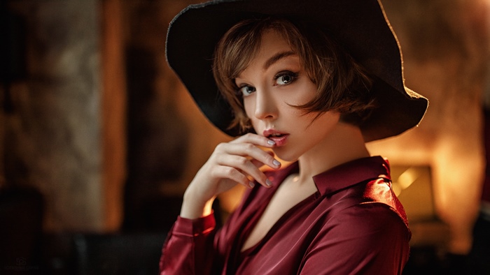 Woman with Short Hair and Blue Eyes Wearing Hat
