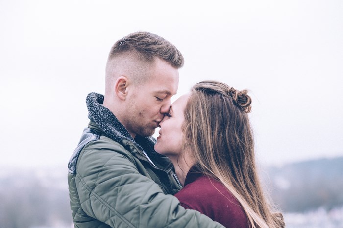 Couple embracing outdoors