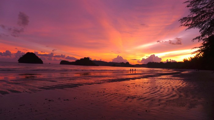 Beach sunset with purple and orange sky