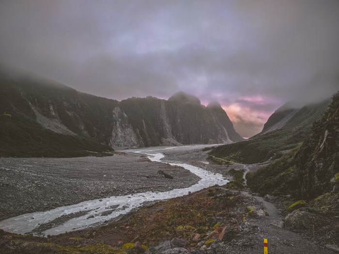 River flowing through a misty mountain valley in New Zealand