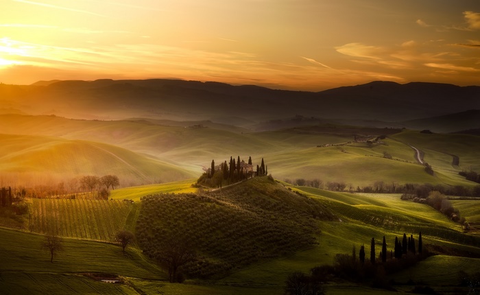 Tuscan Landscape with Rolling Hills and a Villa at Sunset