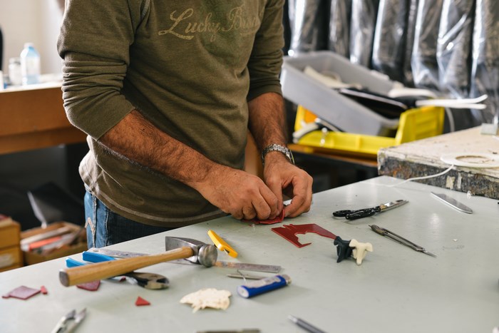 Man working with tools on a table