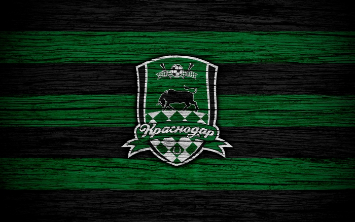 FC Krasnodar logo on a wooden background