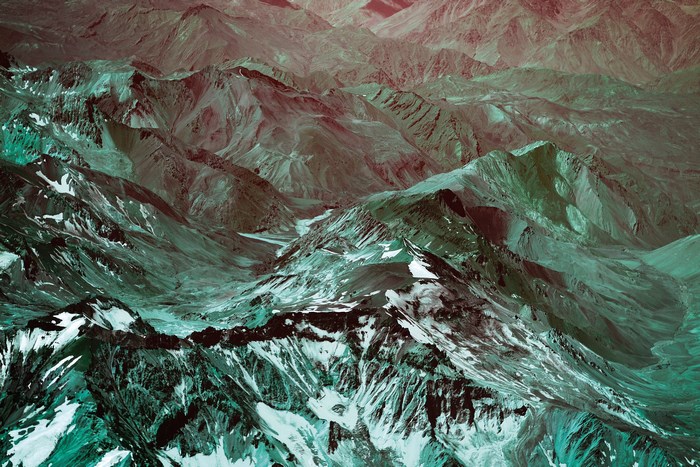 Aerial view of a snow-capped mountain range in the Andes