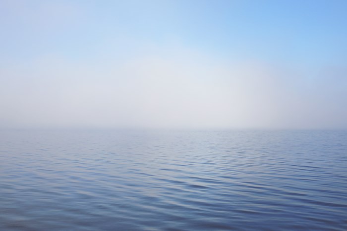 Calm Misty Ocean with Gentle Ripples