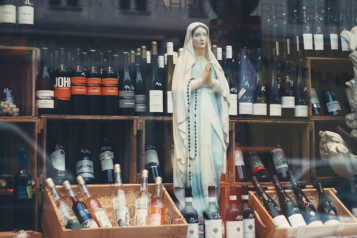 Statue of Mary in a wine shop display