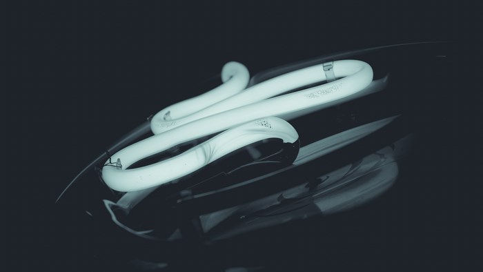 Close-up of a glowing fluorescent light bulb