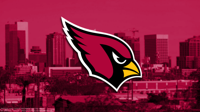Arizona Cardinals logo over cityscape