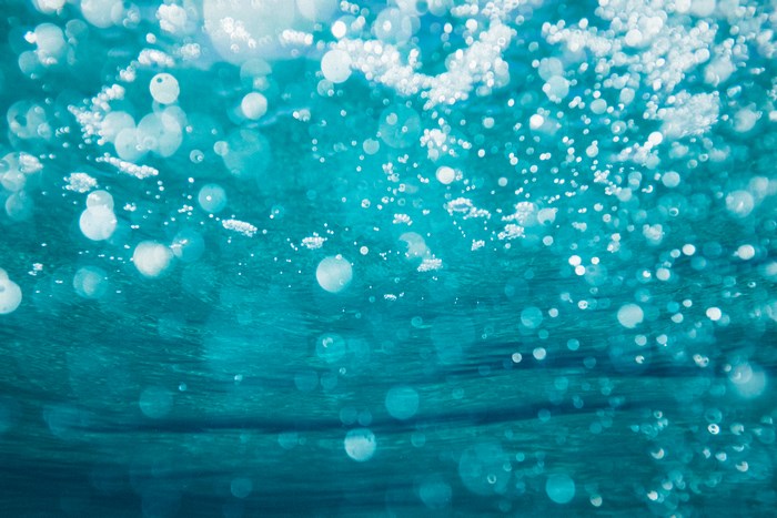 Underwater view with bubbles and light refractions