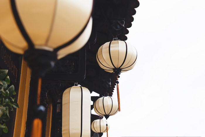 Hoi An paper lanterns hanging from a building