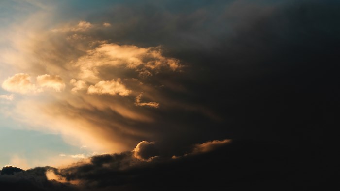 Dramatic Sunset with Dark Storm Clouds