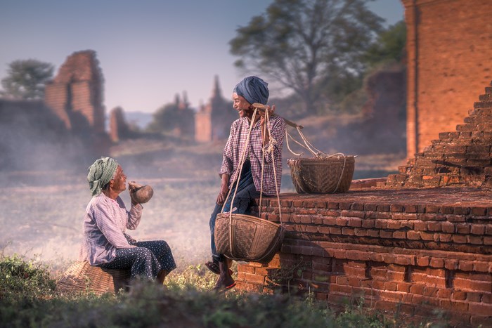 Two Local Men Sharing a Light Moment in Bagan