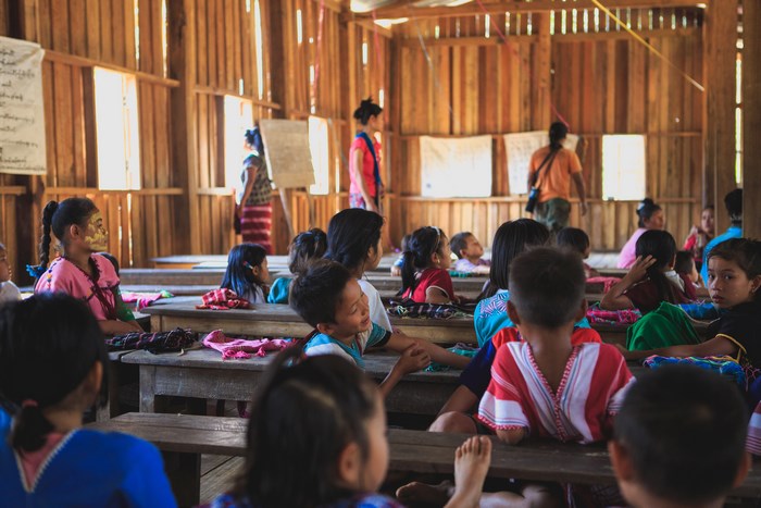 Children in a wooden classroom in Myanmar