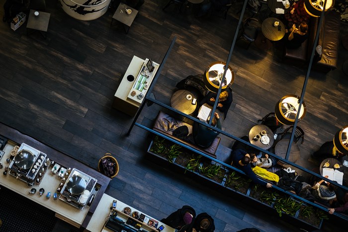 Overhead View of Cozy Cafe with Coffee Machine and Plant