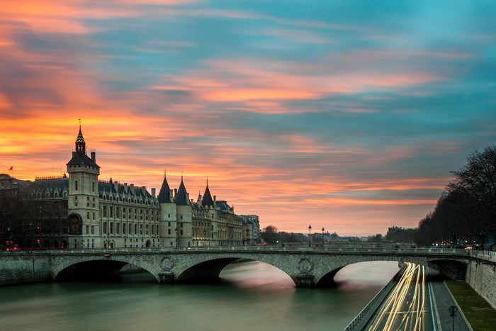 Parisian bridge over the Seine river at sunset