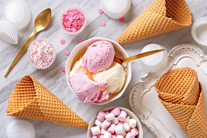 Ice cream scoops with waffle cones and sprinkles