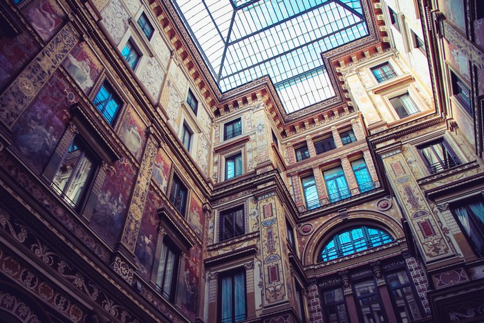 Courtyard with ornate facade and skylight