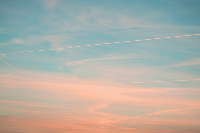 Soft pastel summer sunset sky with clouds
