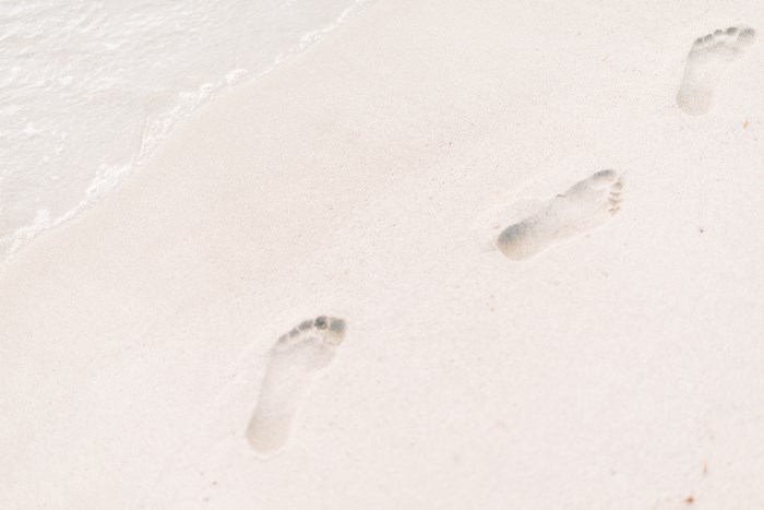Footprints in the Sand on a Beach
