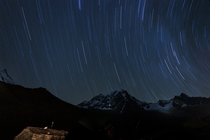 Star trails over snow-capped mountains in Nepal