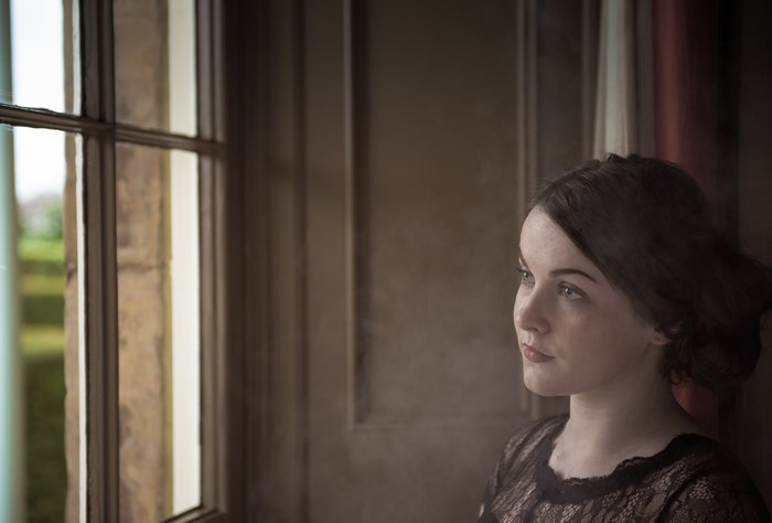 Woman looking out a window