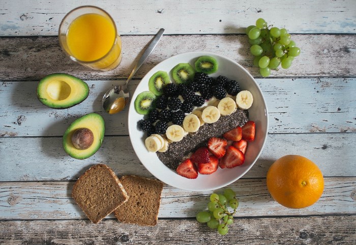 Healthy breakfast bowl with fruits and bread