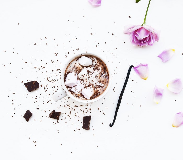Hot chocolate with marshmallows, chocolate, vanilla, and rose petals