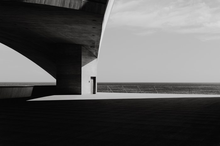 Concrete structure by the sea in black and white
