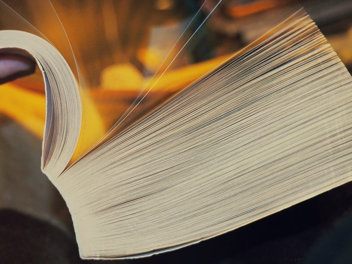 Open book with pages turning