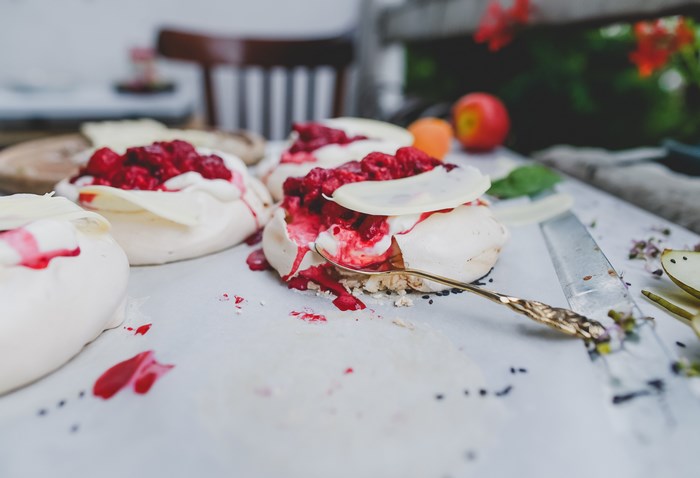 Raspberry Pavlova Desserts with White Chocolate and Spoon