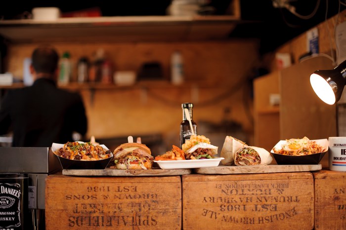 Fast food spread with Jack Daniels bottle