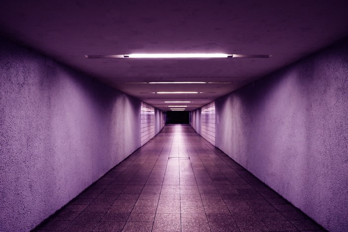 Purple illuminated hallway with neon lights