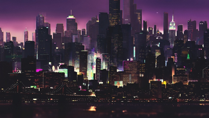 Nighttime cityscape with illuminated skyscrapers and a bridge