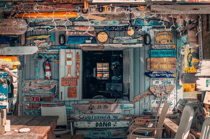 Shop decorated with numerous signs and driftwood