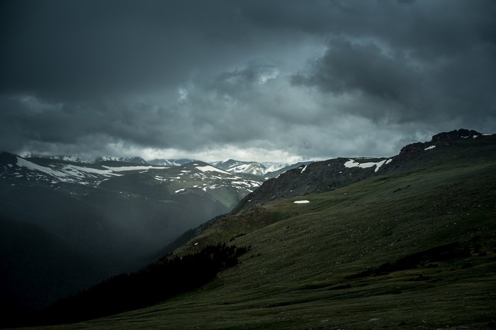Gloomy Mountain Valley with Snow and Clouds in Colorado