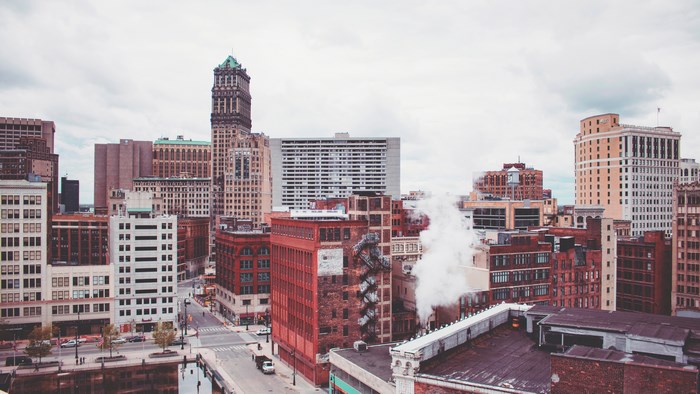 Detroit cityscape with skyscrapers and steam